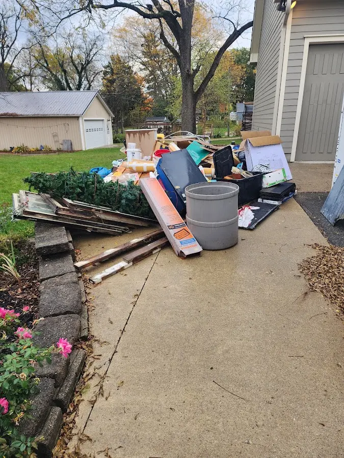 Dumpster being loaded with debris for 30 Yard Dumpster Rental in Netcong